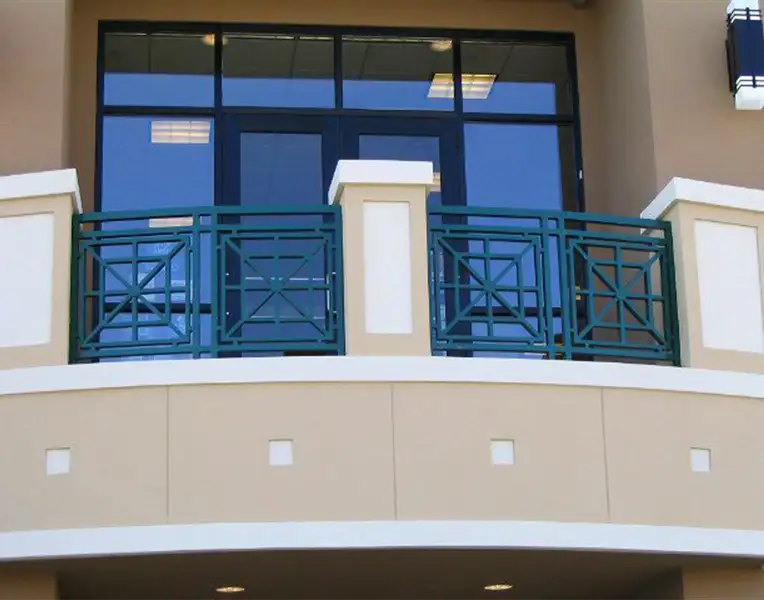 First-floor view of iron railing on second-floor balcony